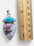 Making Waves Jewelry and Accessories artisan pendant featuring blue Larimar and pink Rhodonite in sterling silver
