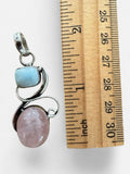 Making Waves Jewelry and Accessories sterling silver pendant with blue Larimar and pink Rose Quartz gemstones.