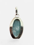 Making Waves Jewelry and Accessories oval Larimar pendant in polished 925 sterling silver with a light blue stone
