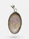 Making Waves Jewelry and Accessories oval pendant featuring a lavender gemstone in a beaded 925 sterling silver bezel.
