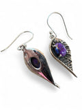Making Waves Jewelry and Accessories sterling silver dangle earrings with purple oval stones in leaf-shaped settings.