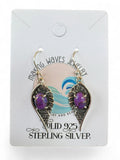 Making Waves Jewelry and Accessories sterling silver dangle earrings with purple oval stones in a leaf-shaped setting.