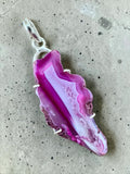 Making Waves Jewelry and Accessories magenta agate slice pendant in a polished sterling silver setting