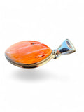 Making Waves Jewelry and Accessories marquise spiny oyster shell pendant in a polished sterling silver bezel setting.