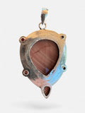 Making Waves Jewelry and Accessories mauve teardrop gemstone pendant in a 925 sterling silver setting with pink accents