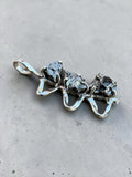 Making Waves Jewelry and Accessories triple meteorite pendant with raw dark iron stones in a polished silver setting