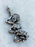 Making Waves Jewelry and Accessories triple meteorite pendant with raw dark iron-nickel stones in polished silver setting