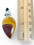 Making Waves Jewelry and Accessories teardrop Mookaite Jasper pendant in sterling silver with a black stone accent