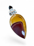 Making Waves Jewelry and Accessories teardrop Mookaite Jasper pendant in sterling silver with a black stone accent.