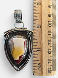 Making Waves Jewelry and Accessories artisan shield pendant with Mookaite Jasper stone in oxidized sterling silver.