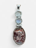 Making Waves Jewelry and Accessories sterling silver pendant with two moonstone cabochons and oval Crazy Lace Agate.