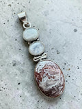 Making Waves Jewelry and Accessories sterling silver pendant with two moonstone cabochons and oval Crazy Lace Agate