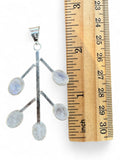 Making Waves Jewelry and Accessories sterling silver branch pendant with five oval moonstone cabochons next to a ruler