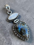 Making Waves Jewelry and Accessories artisan pendant with marquise moonstone and pear labradorite in sterling silver.