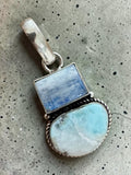 Making Waves Jewelry and Accessories artisan pendant featuring a rectangular moonstone and oval larimar in sterling silver