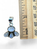 Making Waves Jewelry and Accessories moonstone cluster pendant in 925 sterling silver shown next to a ruler for scale.