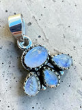Making Waves Jewelry and Accessories moonstone cluster pendant in 925 sterling silver with iridescent blue stones