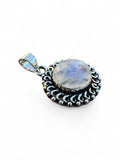 Making Waves Jewelry and Accessories round moonstone pendant with vintage silver scrollwork and bead detailing
