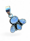 Making Waves Jewelry and Accessories moonstone cluster pendant in 925 sterling silver with iridescent blue gems.