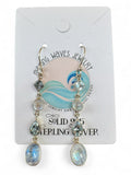 Making Waves Jewelry and Accessories sterling silver drop earrings with iridescent moonstone and blue topaz stones.