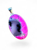 Making Waves Jewelry and Accessories oval pendant featuring a grey and hot pink agate stone set in sterling silver.