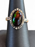 Making Waves Jewelry and Accessories oval ammolite ring in sterling silver with etched bezel and bead accents