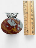 Making Waves Jewelry and Accessories oval jasper pendant with red, ochre, and grey tones and a filigree metal bail.