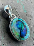 Making Waves Jewelry and Accessories oval doublet opal pendant in a polished sterling silver bezel with blue and green