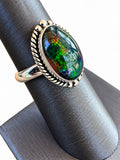 Making Waves Jewelry and Accessories sterling silver ring with a dark oval opal featuring green and red flashes.