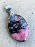 Making Waves Jewelry and Accessories oval rhodonite pendant with pink and black stone in a 925 sterling silver setting