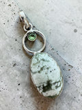 Making Waves Jewelry and Accessories oval stone pendant in sterling silver with a green faceted accent stone