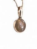 Making Waves Jewelry and Accessories oval iridescent gemstone pendant in a polished sterling silver bezel on a box chain