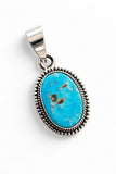 Making Waves Jewelry and Accessories oval turquoise pendant in 925 sterling silver with a beaded border detail.