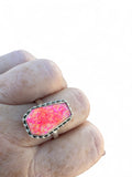 Making Waves Jewelry and Accessories neon pink coffin-shaped stone ring with beaded sterling silver setting on hand