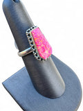 Making Waves Jewelry and Accessories sterling silver ring with an elongated neon pink coffin-shaped stone and beading.