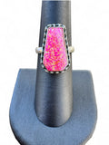 Making Waves Jewelry and Accessories handcrafted sterling silver ring with a neon pink coffin-shaped stone and beading.