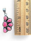 Making Waves Jewelry and Accessories sterling silver pendant with six pink opal cabochons and beaded bezel detail.