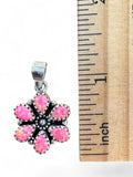 Making Waves Jewelry and Accessories pink opal flower pendant in 925 sterling silver next to a ruler for scale