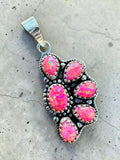 Making Waves Jewelry and Accessories sterling silver pendant featuring six vibrant pink opal cabochons with beaded detail