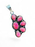 Making Waves Jewelry and Accessories sterling silver pendant featuring six vibrant pink opal cabochons in a cluster.