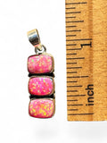 Making Waves Jewelry and Accessories triple square pink opal pendant in sterling silver next to a ruler for scale.