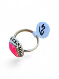 Making Waves Jewelry and Accessories sterling silver ring with a neon pink coffin-shaped stone and beaded detailing.