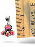 Making Waves Jewelry and Accessories pink stone cluster pendant in sterling silver with rope detailing next to a ruler