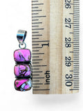 Making Waves Jewelry and Accessories triple pink turquoise stone pendant in sterling silver next to a ruler for scale.