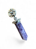 Making Waves Jewelry and Accessories purple crystal point pendant with intricate silver-tone spiral metalwork detail