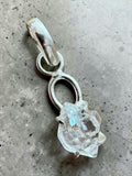 Making Waves Jewelry and Accessories raw Herkimer diamond crystal pendant in a minimalist sterling silver setting.