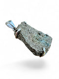 Making Waves Jewelry and Accessories raw pyrite pendant in a polished 925 sterling silver setting.
