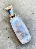 Making Waves Jewelry and Accessories rectangular moonstone pendant with blue flash in a 925 sterling silver bezel.
