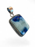 Making Waves Jewelry and Accessories rectangular gemstone pendant in blue and white stone with sterling silver bezel.