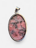 Making Waves Jewelry and Accessories oval rhodonite pendant with black inclusions set in polished sterling silver